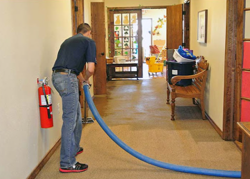 Water extraction in hallway using professional equipment